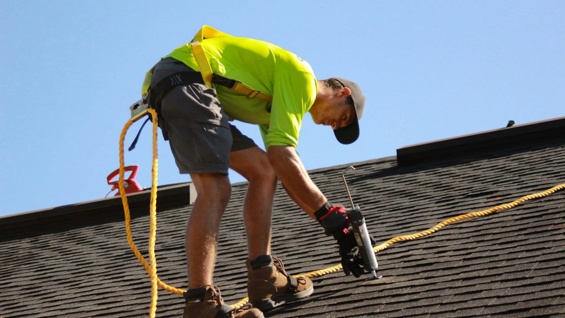Roofing professional installing shingles on a Fairfield County home