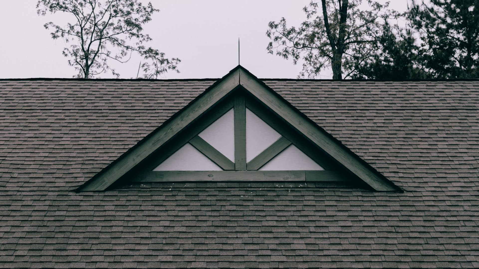 Roofers installing a new roof on a Fairfield County home